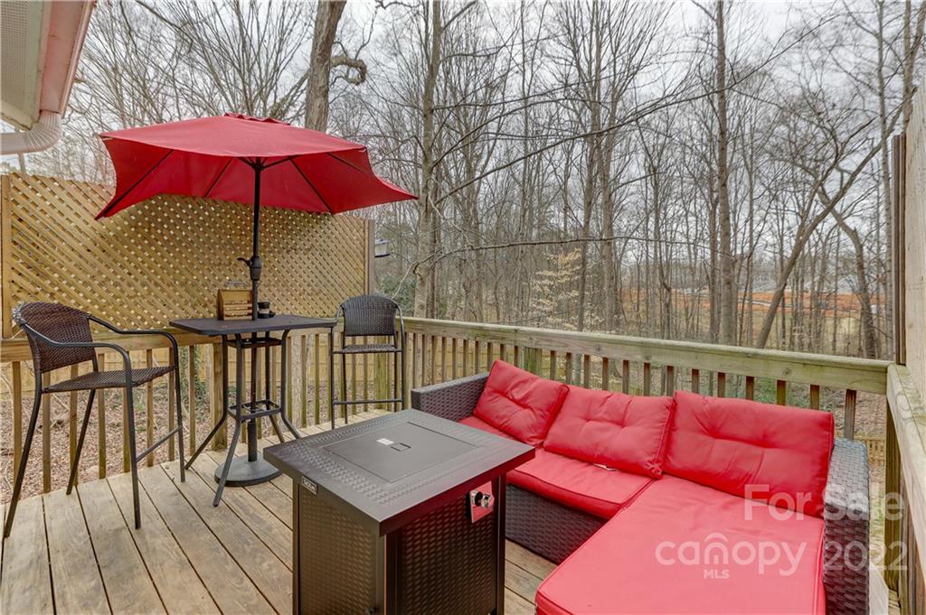 8216 Pine Oak Road Waxhaw, NC 28173 - Photo 35 of 39 a balcony with table and chairs
