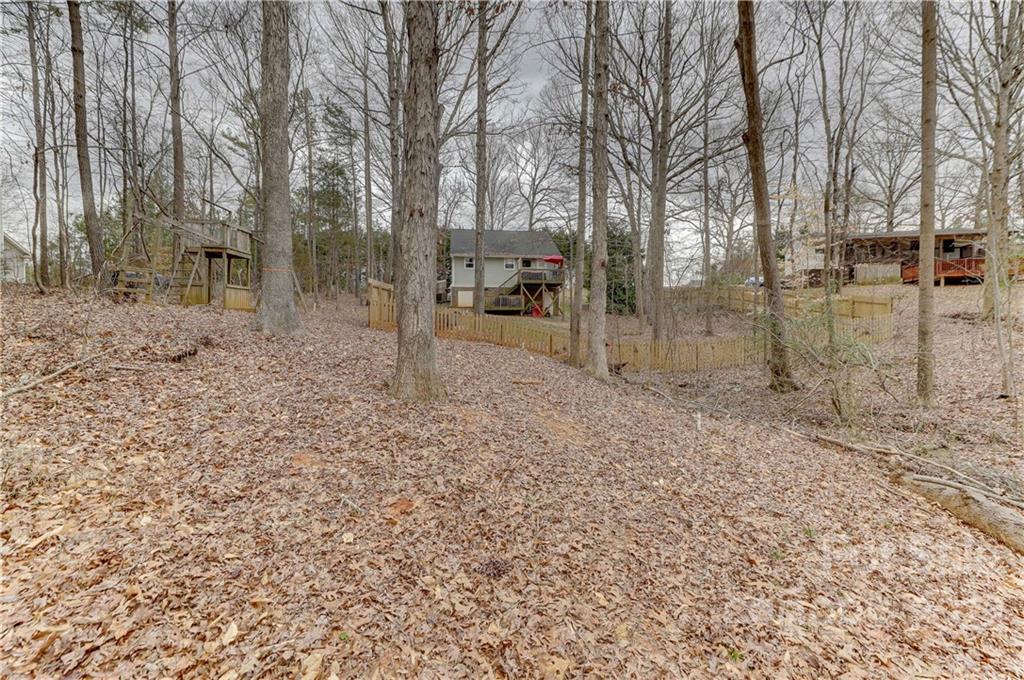 8216 Pine Oak Road Waxhaw, NC 28173 - Photo 38 of 39 a view of a yard with large trees