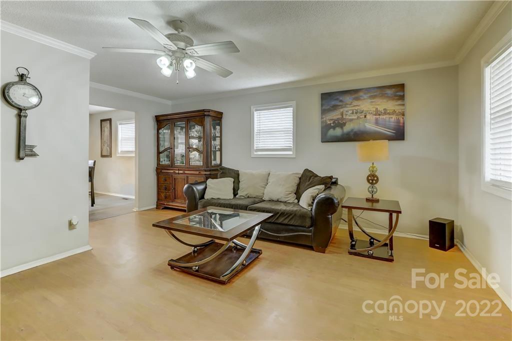8216 Pine Oak Road Waxhaw, NC 28173 - Photo 7 of 39 a living room with furniture gym equipment and a window