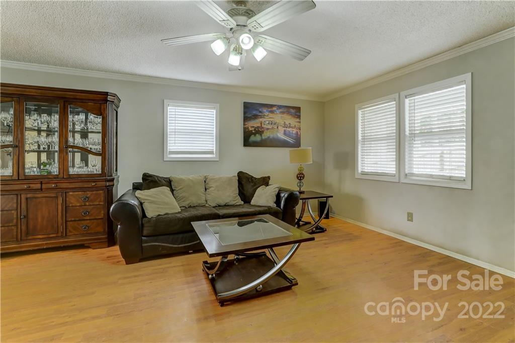 8216 Pine Oak Road Waxhaw, NC 28173 - Photo 8 of 39 a living room with furniture and a window