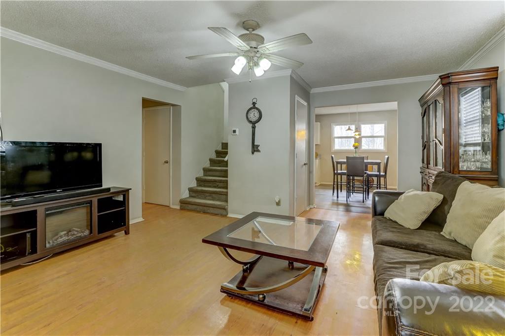 8216 Pine Oak Road Waxhaw, NC 28173 - Photo 10 of 39 a living room with furniture and a flat screen tv