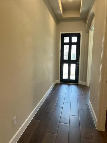 a view of gallery with wooden floor