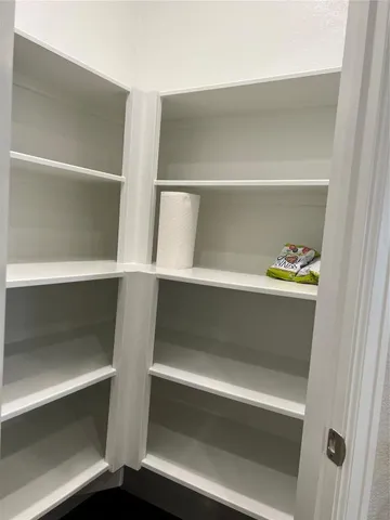 a metallic refrigerator freezer sitting in a kitchen