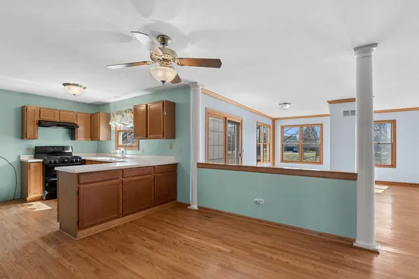 a kitchen with stainless steel appliances granite countertop a stove and a sink