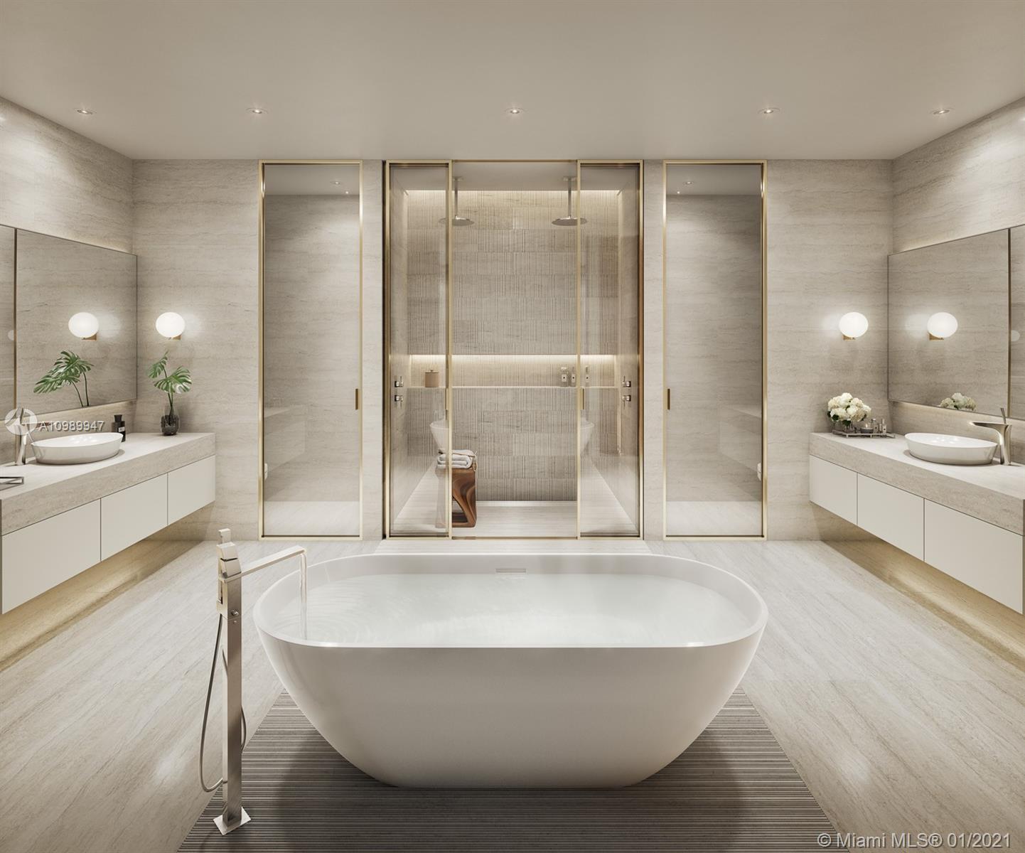 5775 Collins Avenue, Unit PH Miami Beach, FL 33140 - Photo 14 of 23 a bathroom with a tub a sink and a glass door shower