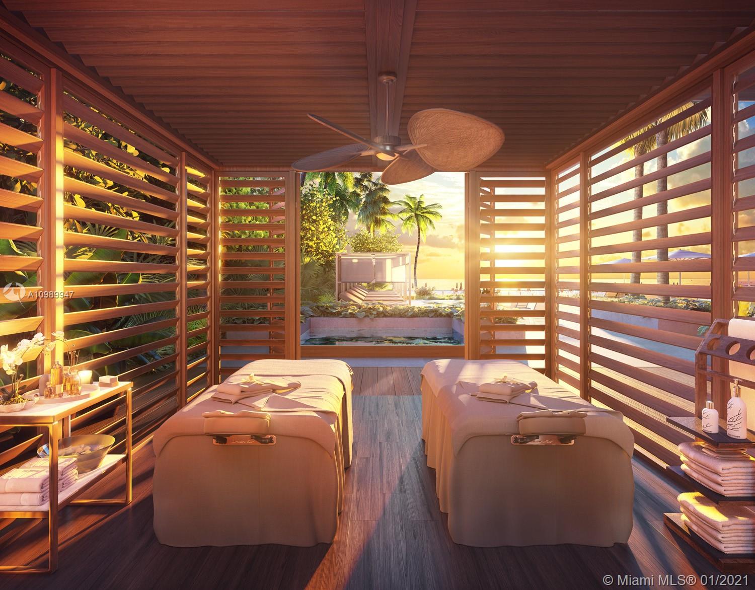 5775 Collins Avenue, Unit PH Miami Beach, FL 33140 - Photo 17 of 23 a balcony with table and chairs and potted plants