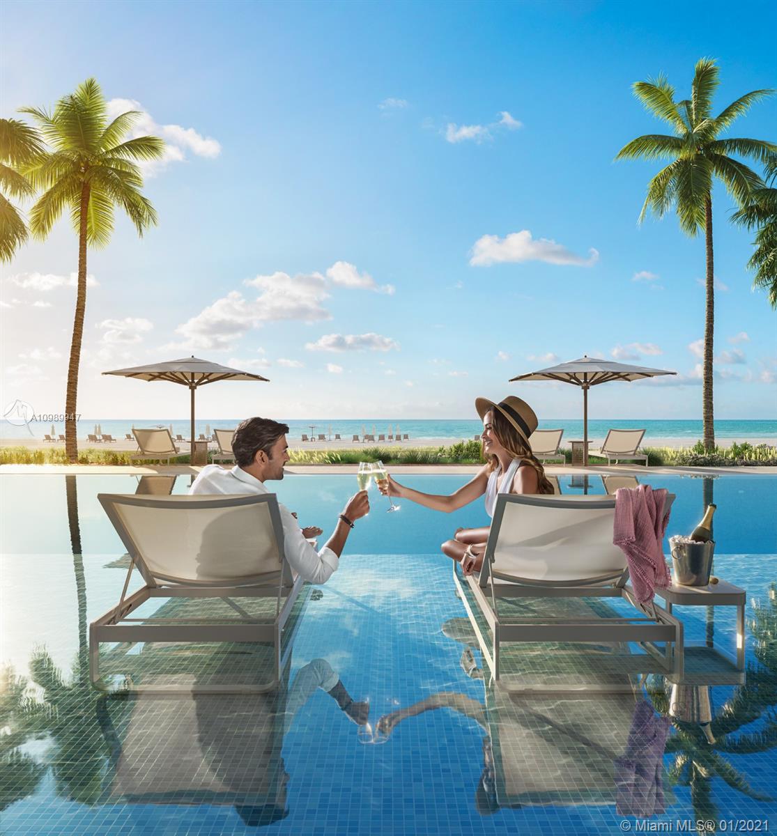 5775 Collins Avenue, Unit PH Miami Beach, FL 33140 - Photo 19 of 23 a view of a swimming pool with a lounge chair