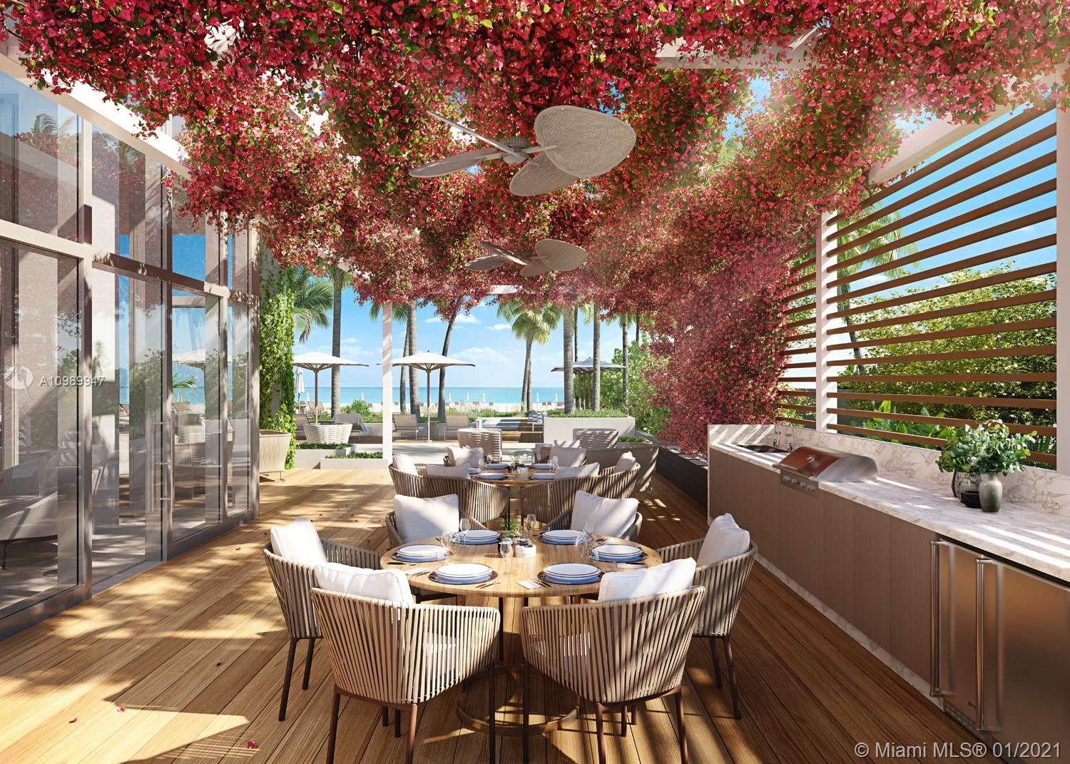 5775 Collins Avenue, Unit PH Miami Beach, FL 33140 - Photo 6 of 23 a view of a patio with a dining table and chairs