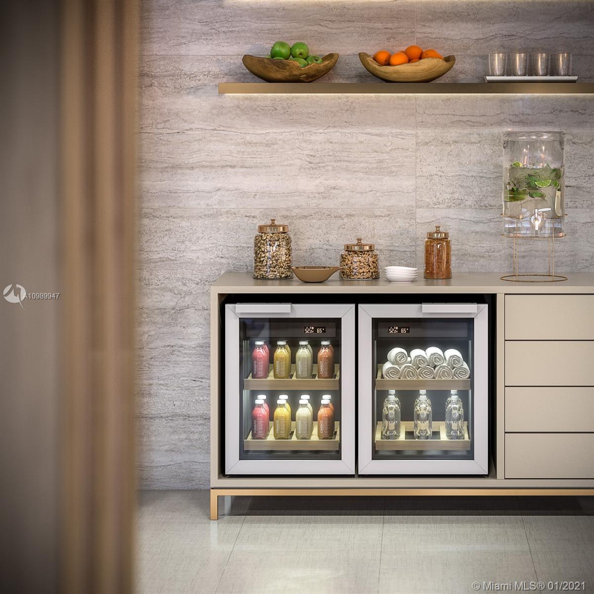 5775 Collins Avenue, Unit PH Miami Beach, FL 33140 - Photo 9 of 23 a front door with a wooden bench