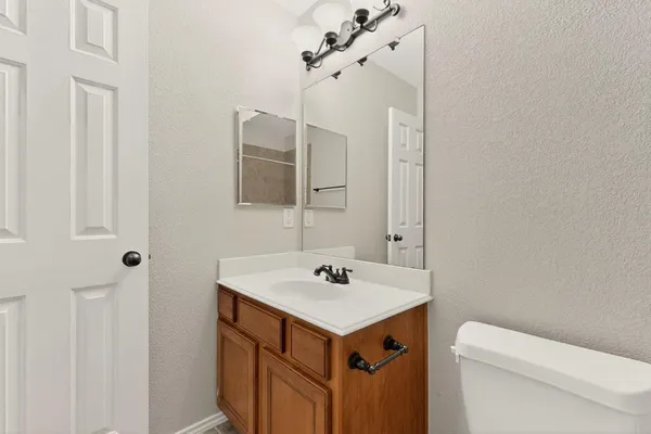 a bathroom with a sink a toilet and a bathtub