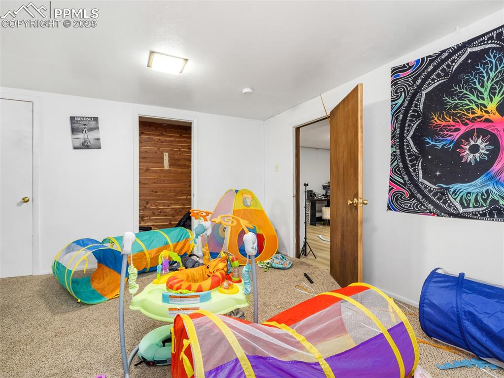2123 Ridgewood Lane Pueblo, CO 81005 - Photo 14 of 19 a bedroom with two beds and a bed