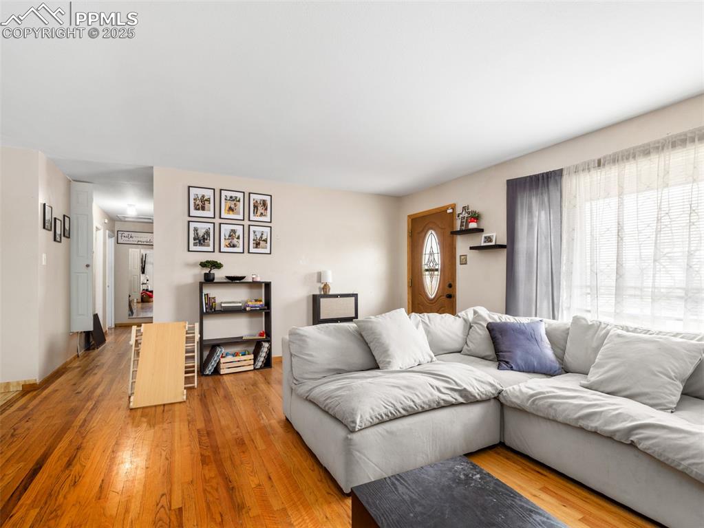 2123 Ridgewood Lane Pueblo, CO 81005 - Photo 5 of 19 a living room with furniture and a wooden floor