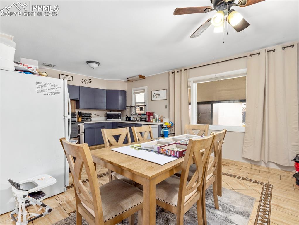 2123 Ridgewood Lane Pueblo, CO 81005 - Photo 7 of 19 a view of a dining room with furniture