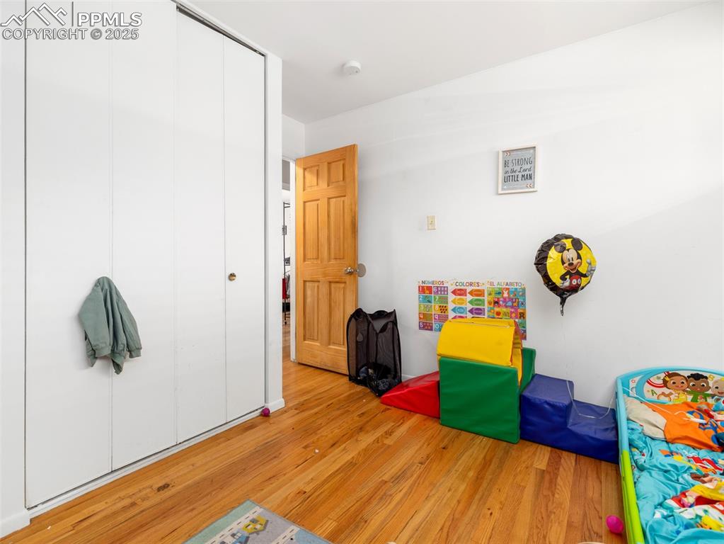 2123 Ridgewood Lane Pueblo, CO 81005 - Photo 9 of 19 a room with a bed and toys on the wall