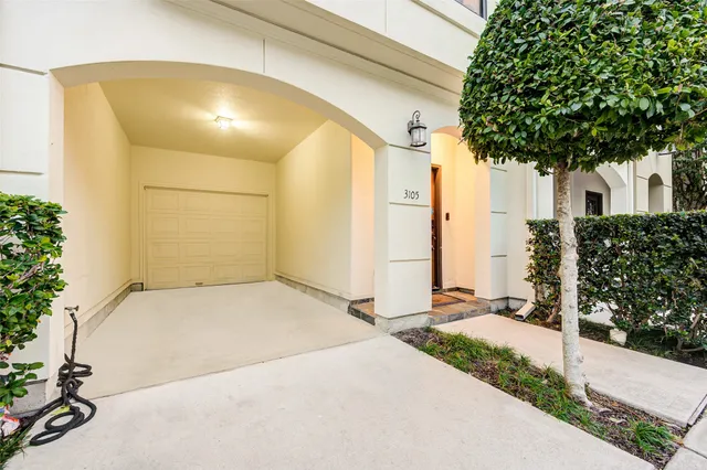 a front view of a house with a garage