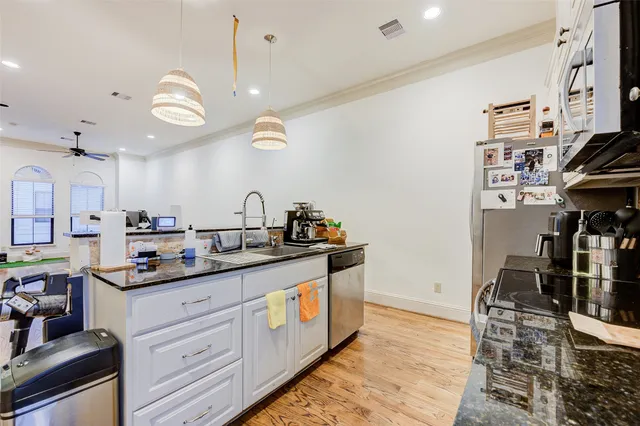 a kitchen with a sink and cabinets