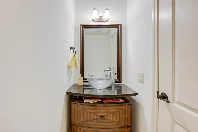 a view of bathroom with a sink and a mirror