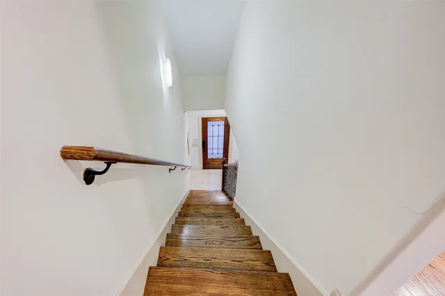 a view of a hallway with stairs