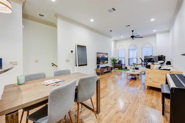 a large kitchen with a table and chairs in it