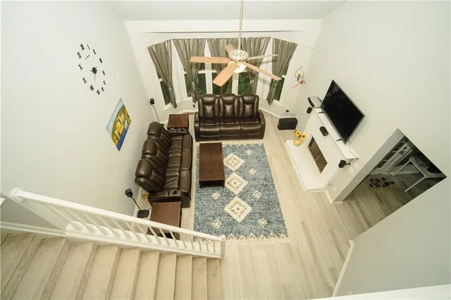 a living room with furniture and a rug