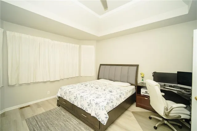 a bedroom with a bed and a walk in closet