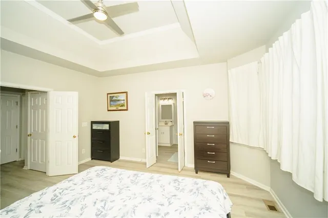 a bathroom with a tub sink and shower
