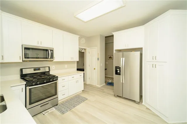 a view of a chairs and table in a patio