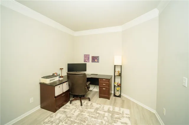 a workspace with furniture window and wooden floor