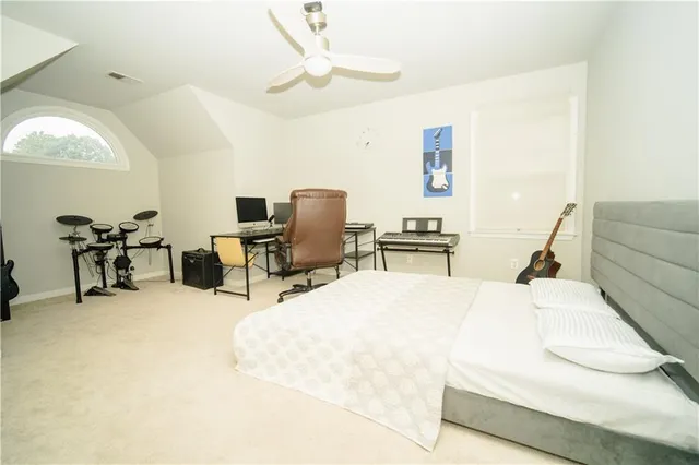 a view of a livingroom with workspace and a window