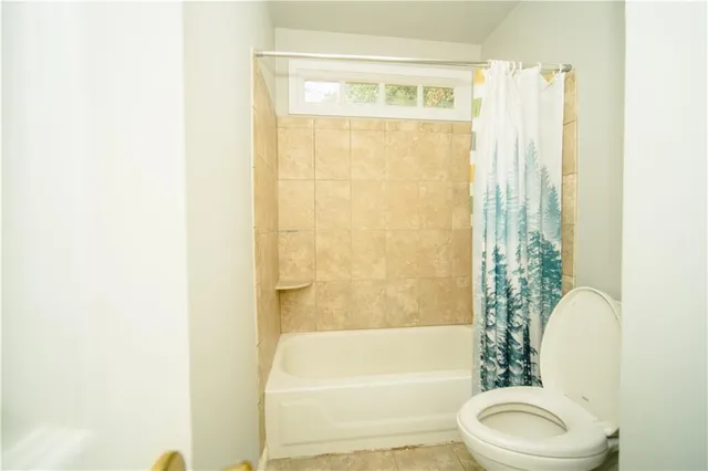 a view of a hallway with a living room