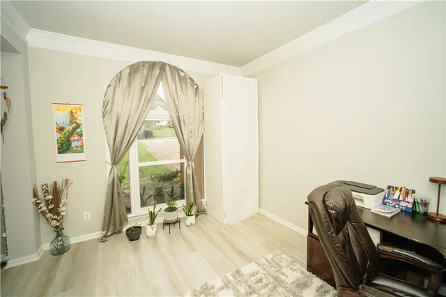 a view of a dining room with furniture wooden floor and a chandelier