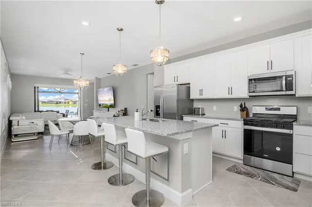 a kitchen with lots of counter space and appliances