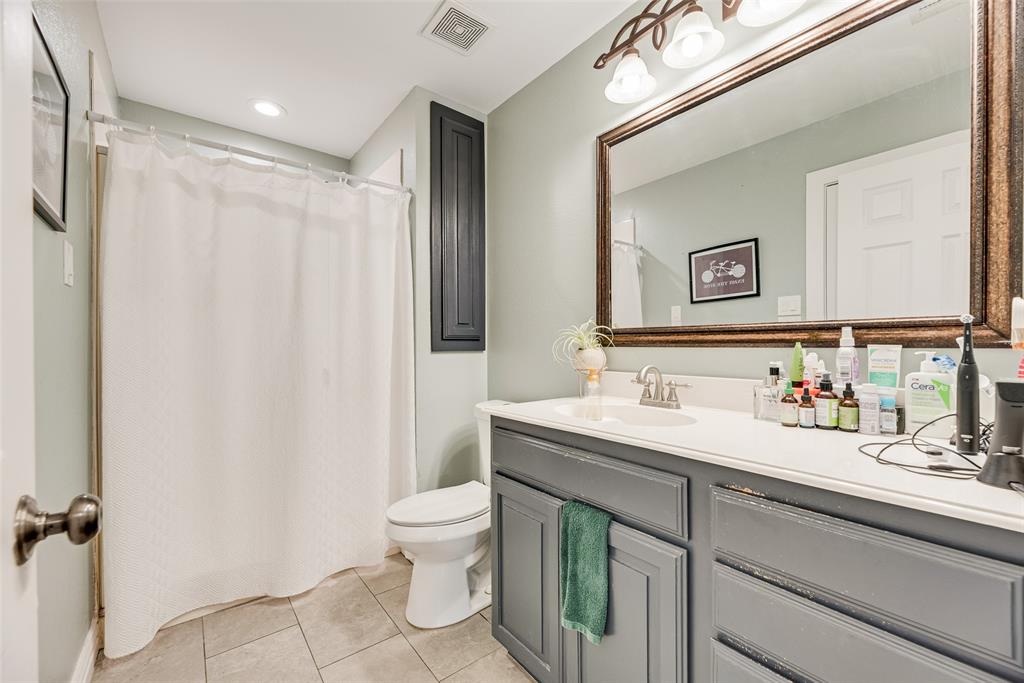 1624 Cemetery Road Royse City, TX 75189 - Photo 11 of 40 a bathroom with a toilet sink and mirror