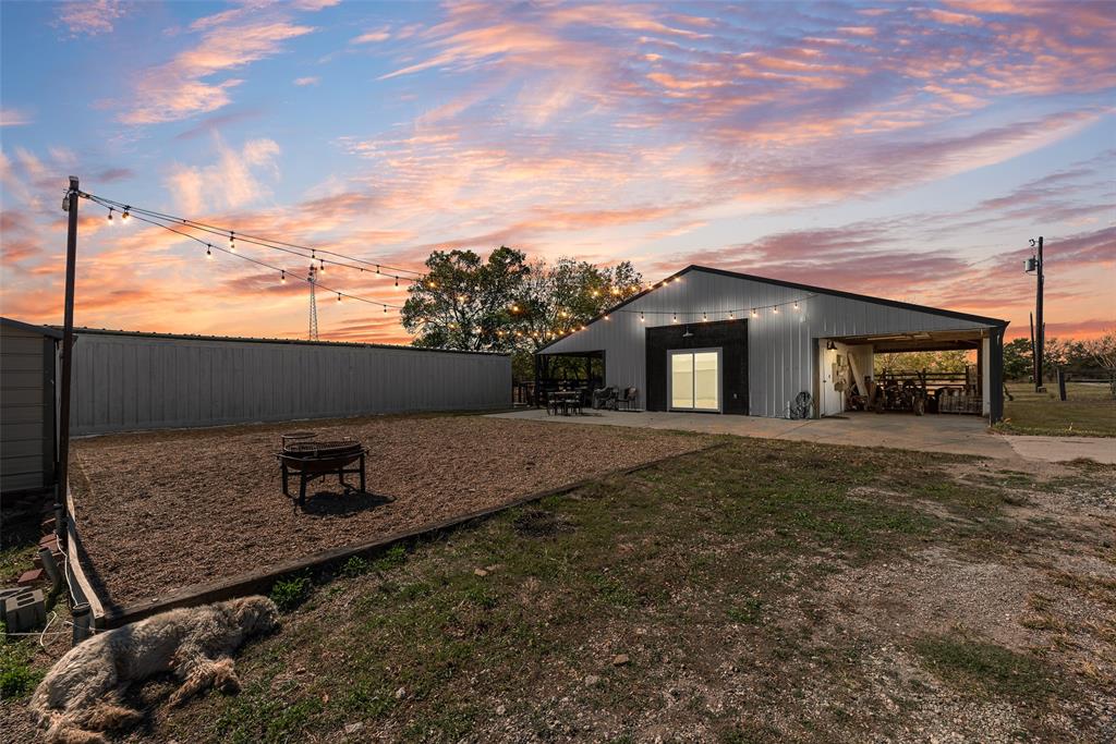 1624 Cemetery Road Royse City, TX 75189 - Photo 16 of 40 a backyard of a house with table and chairs