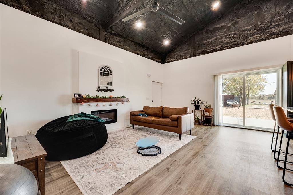 1624 Cemetery Road Royse City, TX 75189 - Photo 17 of 40 a room with furniture and a wooden floor