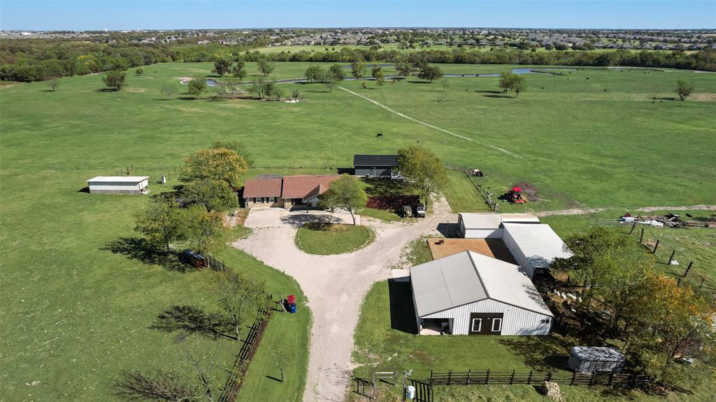 1624 Cemetery Road Royse City, TX 75189 - Photo 2 of 40 an aerial view of a house with outdoor space and a lake view