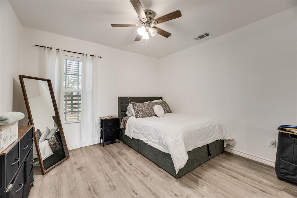 1624 Cemetery Road Royse City, TX 75189 - Photo 22 of 40 a bedroom with a bed and a flat tv screen on the dresser