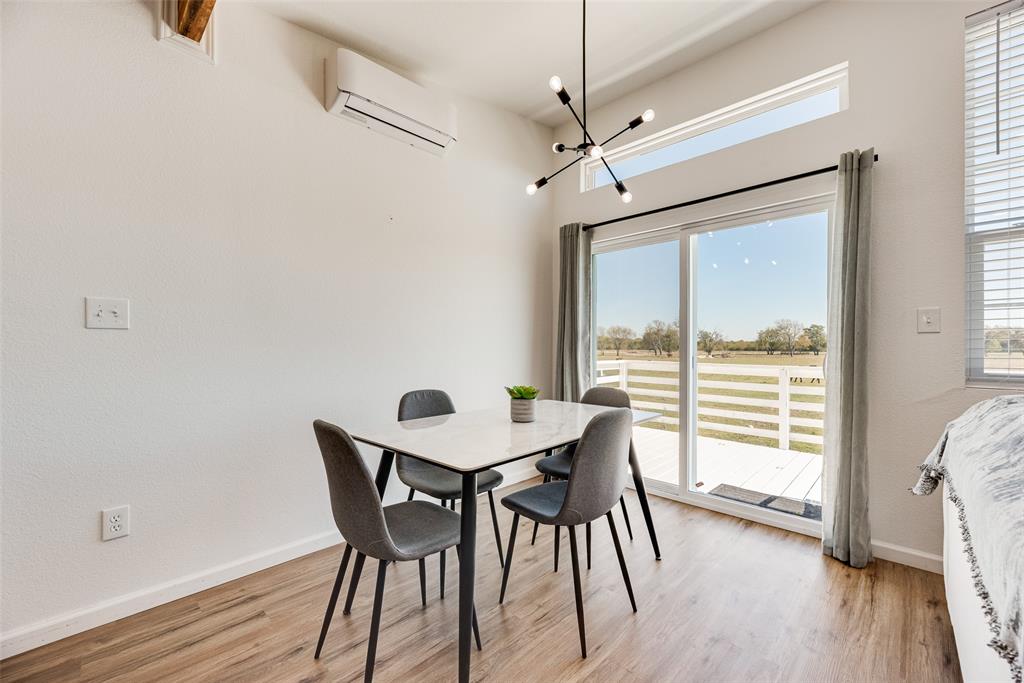 1624 Cemetery Road Royse City, TX 75189 - Photo 28 of 40 a view of a dining room with furniture window and wooden floor