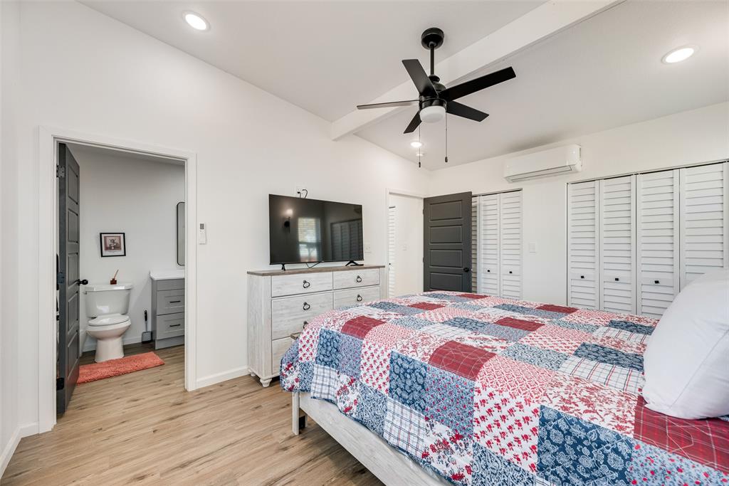 1624 Cemetery Road Royse City, TX 75189 - Photo 31 of 40 a bedroom with a bed and a flat screen tv