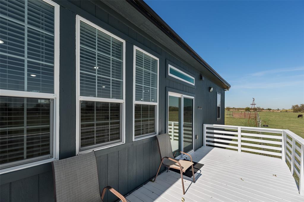 1624 Cemetery Road Royse City, TX 75189 - Photo 35 of 40 a view of deck with two chair and a potted plant