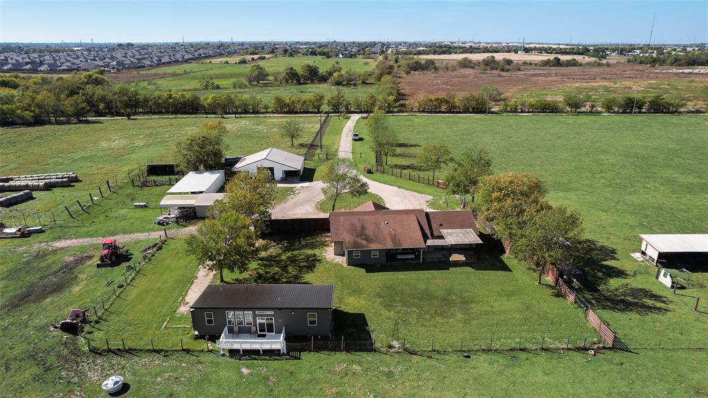 1624 Cemetery Road Royse City, TX 75189 - Photo 39 of 40 an aerial view of a house with a garden and lake view