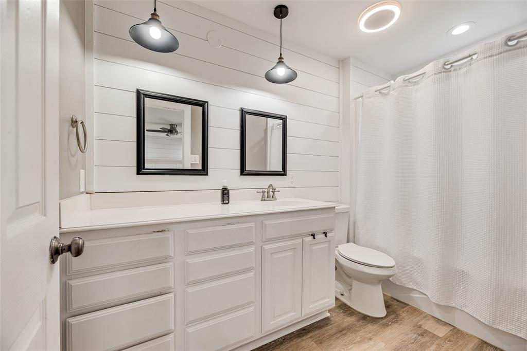 1624 Cemetery Road Royse City, TX 75189 - Photo 9 of 40 a bathroom with a toilet sink and mirror