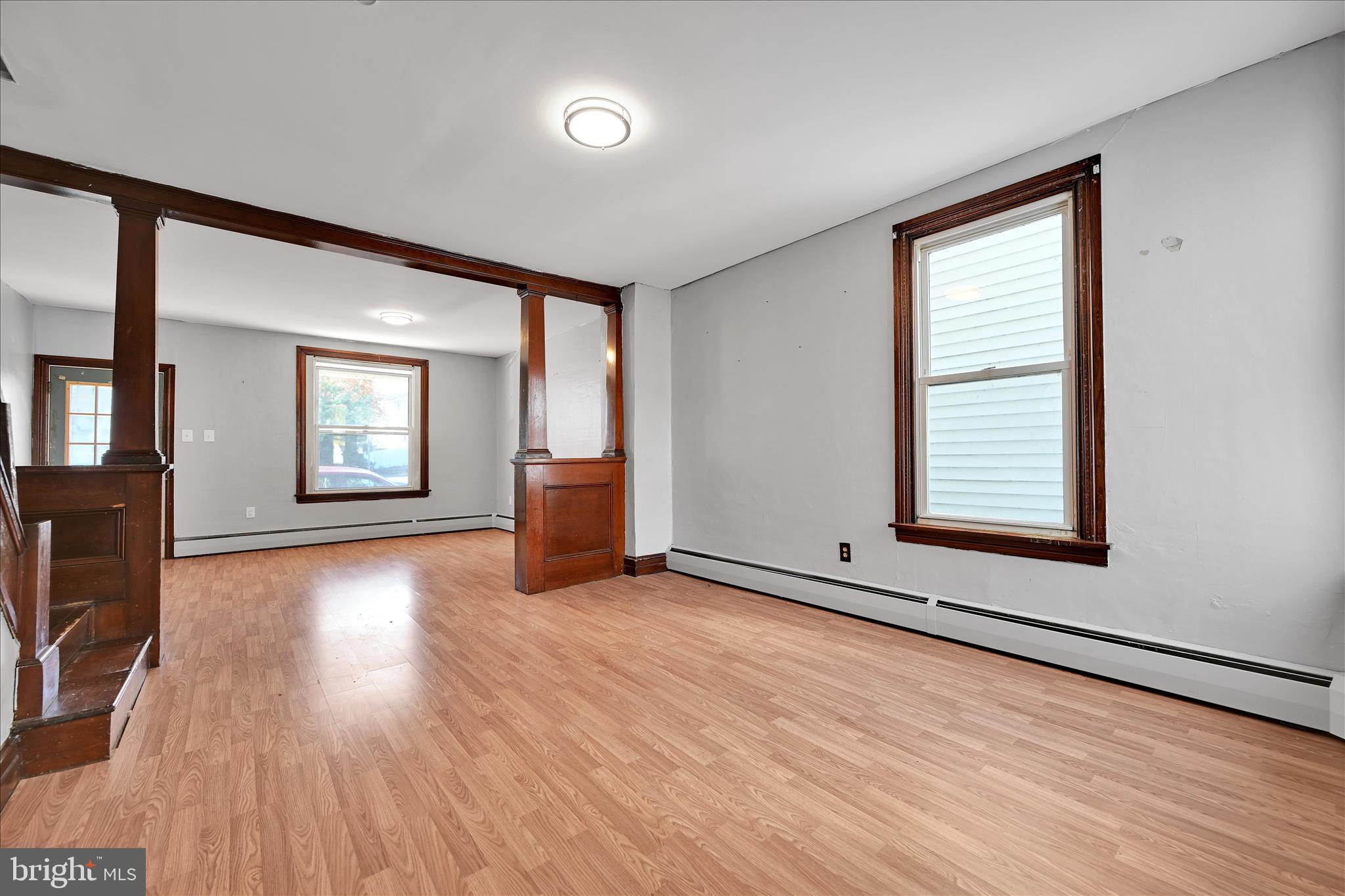 61 Mifflin Street Pine Grove, PA 17963 - Photo 11 of 31 an empty room with wooden floor and windows