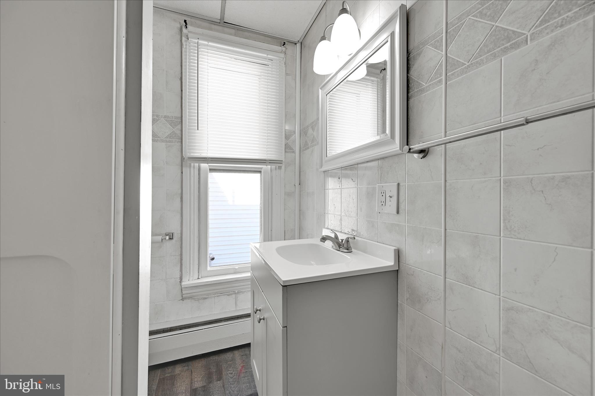 61 Mifflin Street Pine Grove, PA 17963 - Photo 17 of 31 a bathroom with a sink and a mirror