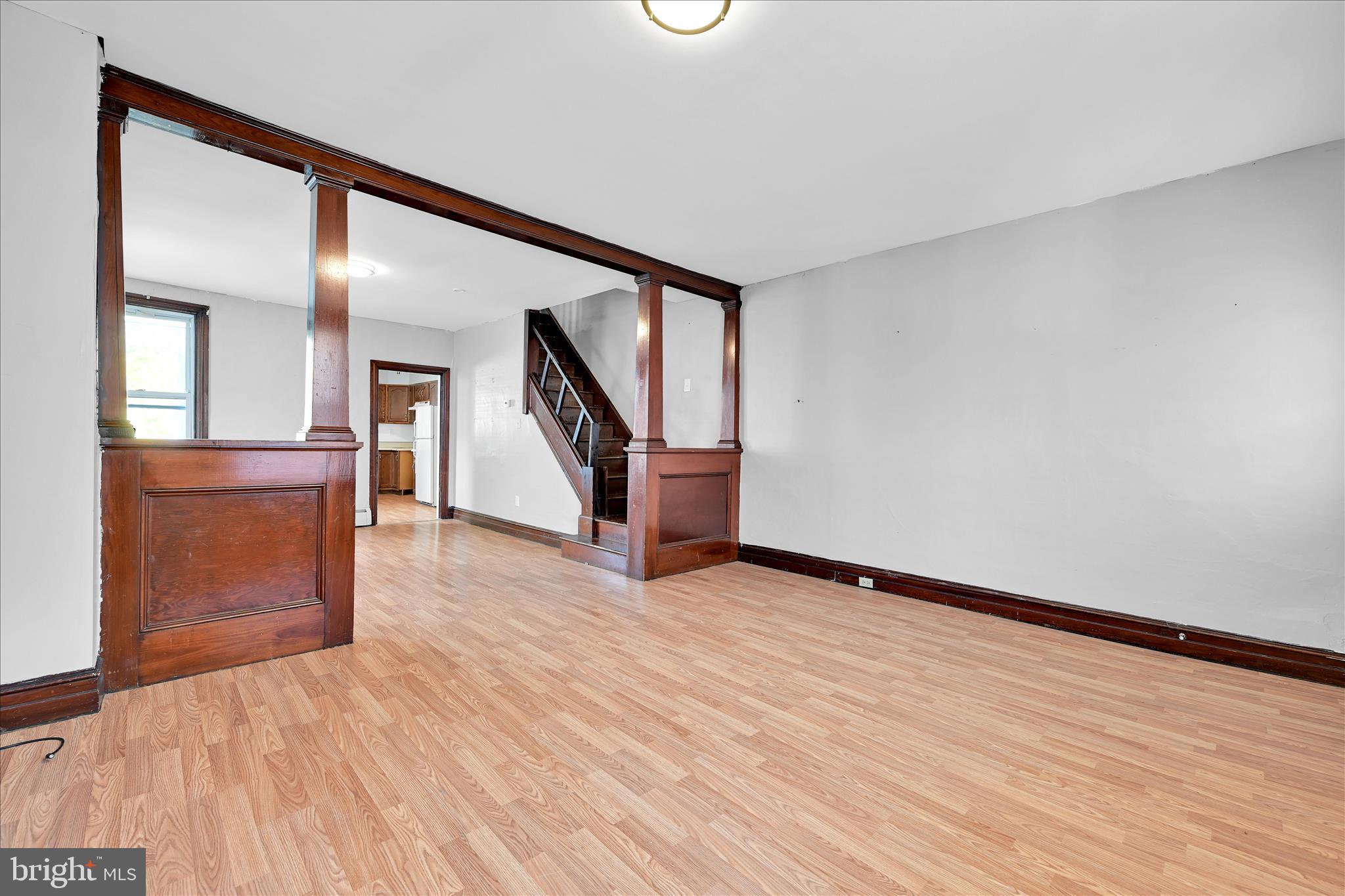 61 Mifflin Street Pine Grove, PA 17963 - Photo 8 of 31 a view of an empty room with wooden floor and stairs