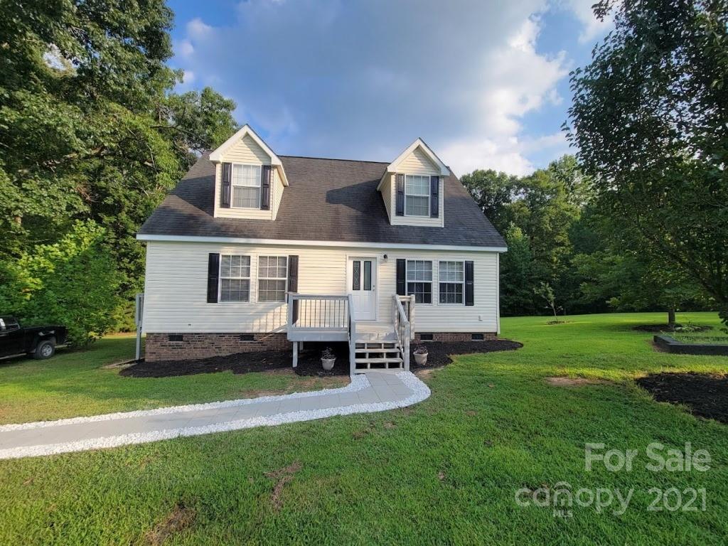 212 Hatchway Road, Unit A & B Indian Land, SC 29707 - Photo 1 of 27 a front view of a house with a garden and yard