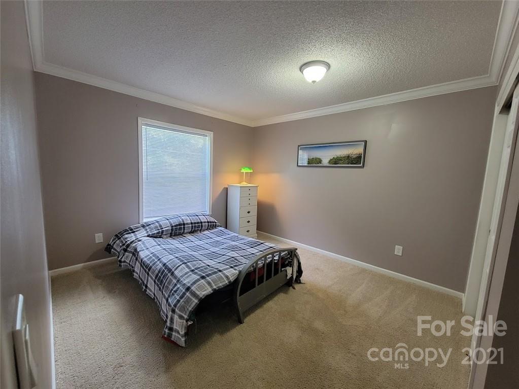 212 Hatchway Road, Unit A & B Indian Land, SC 29707 - Photo 14 of 27 a bedroom with a bed and window