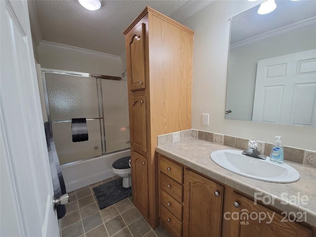 212 Hatchway Road, Unit A & B Indian Land, SC 29707 - Photo 16 of 27 a bathroom with a granite countertop sink toilet and shower