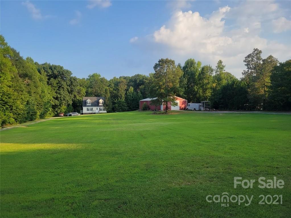 212 Hatchway Road, Unit A & B Indian Land, SC 29707 - Photo 21 of 27 a view of a field of grass and trees
