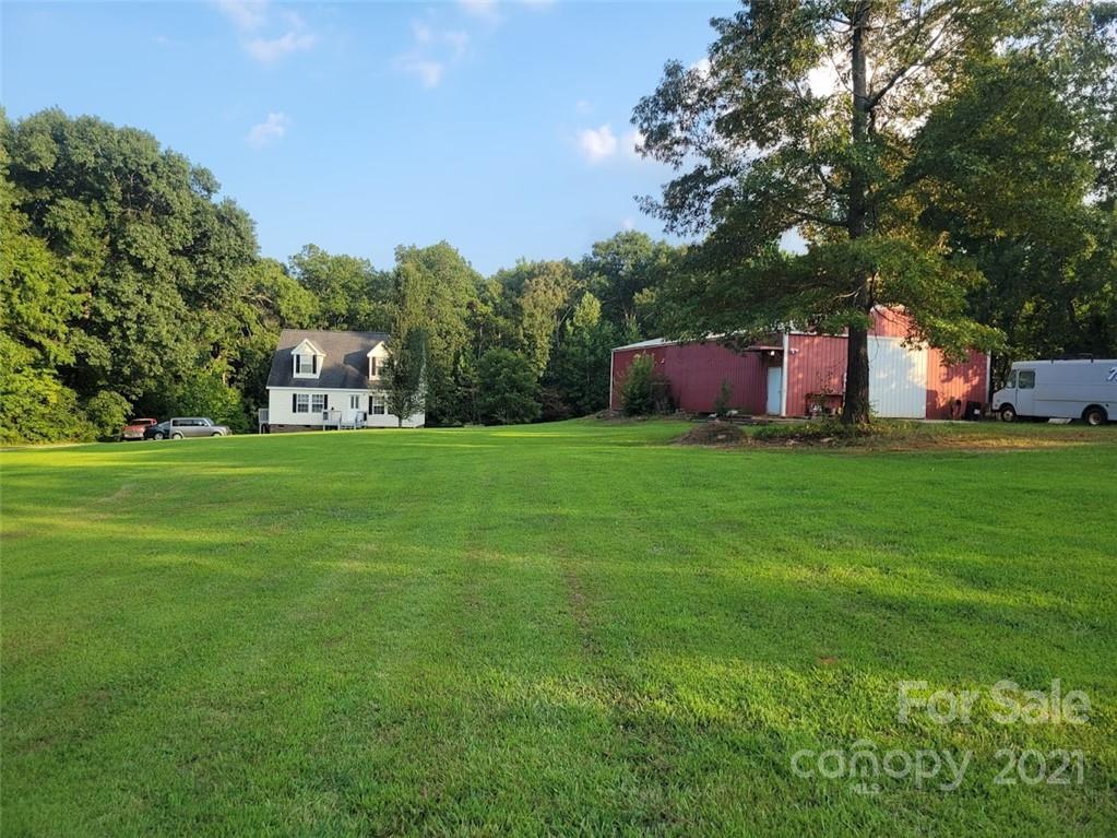 212 Hatchway Road, Unit A & B Indian Land, SC 29707 - Photo 22 of 27 a backyard of a house with table and chairs